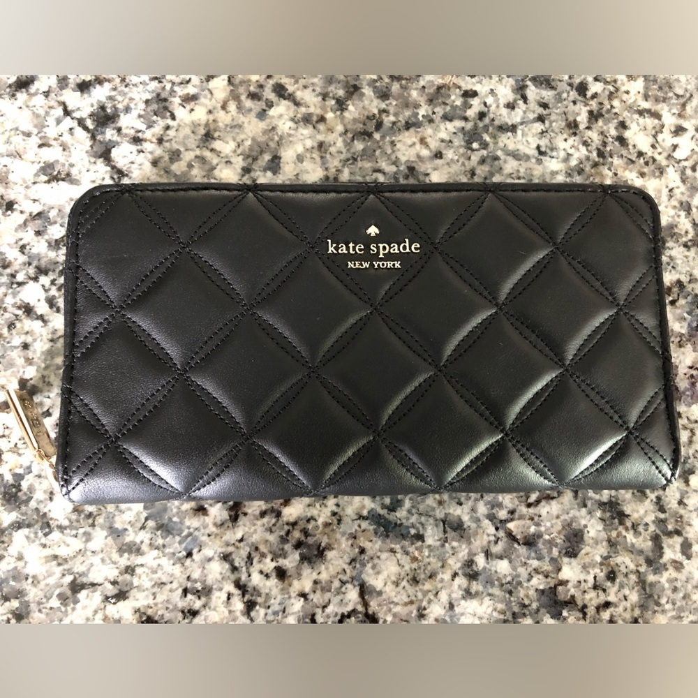 Kate Spade Natalia large continental wallet in black quilted leather.